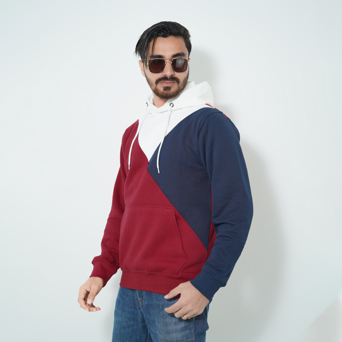 Male model wearing Fils Premium Pullover Hoodie – Colorway.