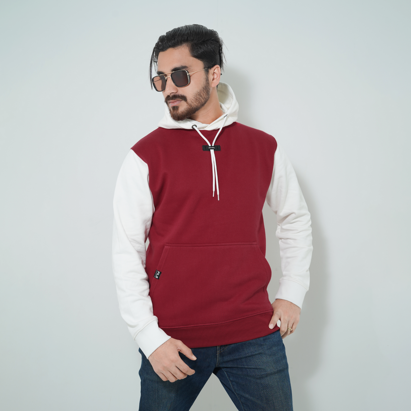 Male model wearing Fils Premium Pullover Hoodie - Cozy Crimson
