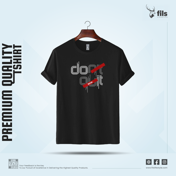 Black t-shirt with 'don't quit' design on a hanger against a light blue background