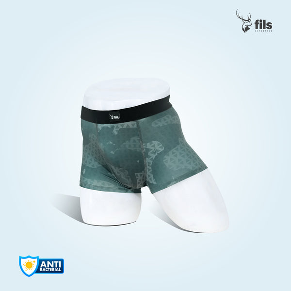 Green patterned boxer briefs on a mannequin with 'fils' branding and antibacterial logo.