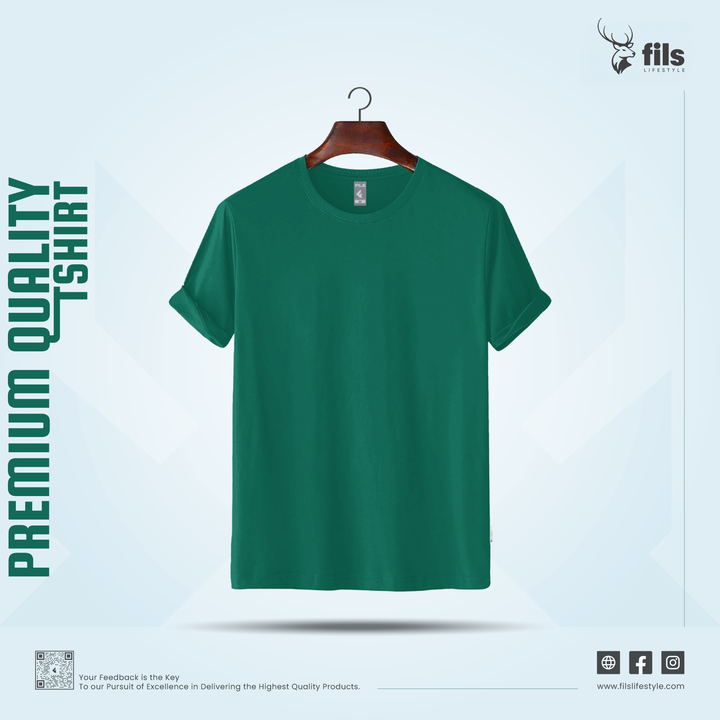 Green t-shirt on a hanger with 'Premium Quality Tshirt' text and 'fils' brand logo.
