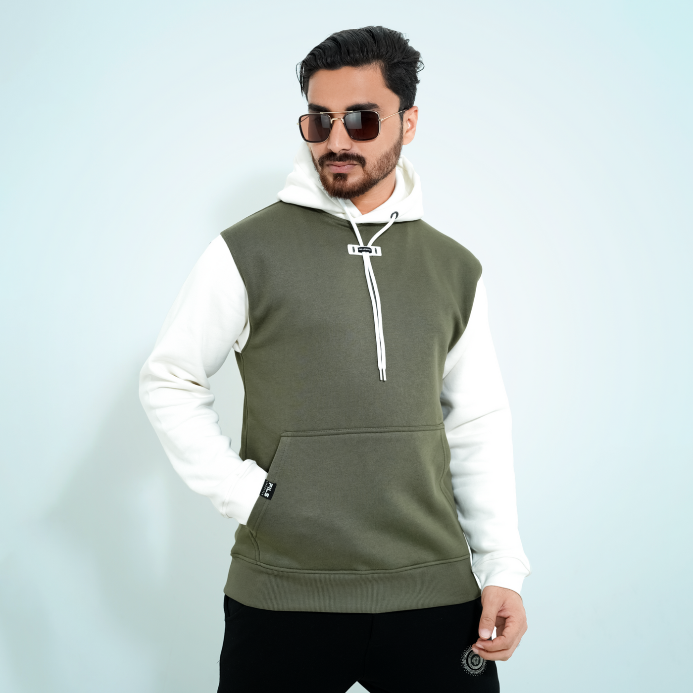 Male model wearing the Fils Lifestyle Premium Pullover Hoodie in Olive Mist