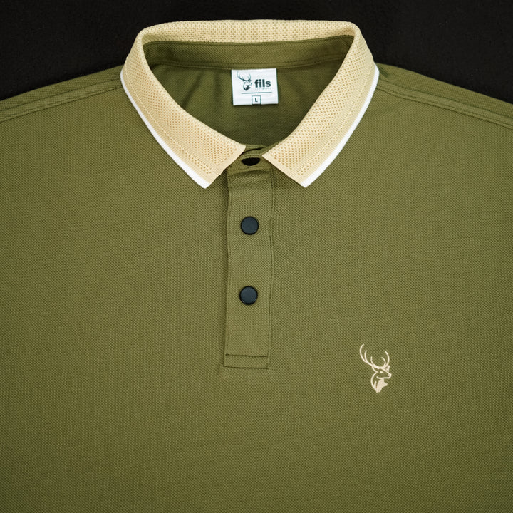 Green polo shirt with beige collar and fils logo on a black background