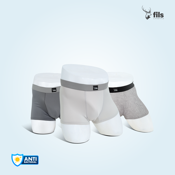 Three pairs of men's underwear in gray and white on a light blue background with 'fils' branding.