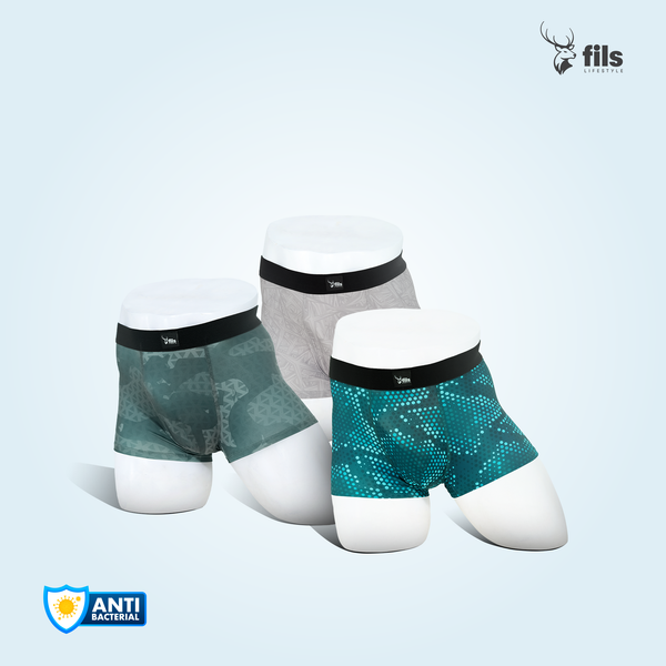 Three pairs of men's underwear on mannequins with 'fils lifestyle' branding and antibacterial logo.